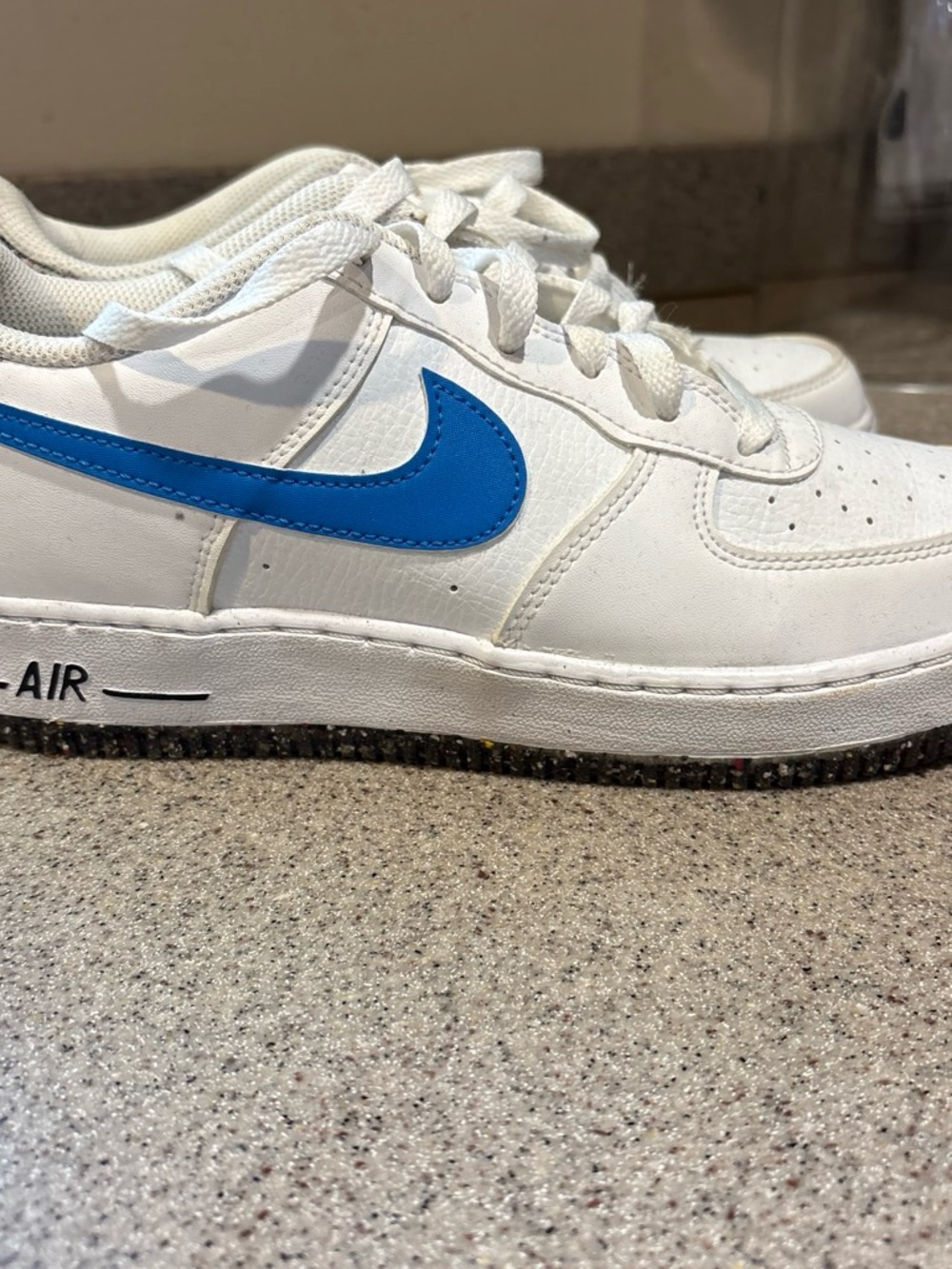 Nike White Low-Top Sneaker with Bright Blue Swoosh